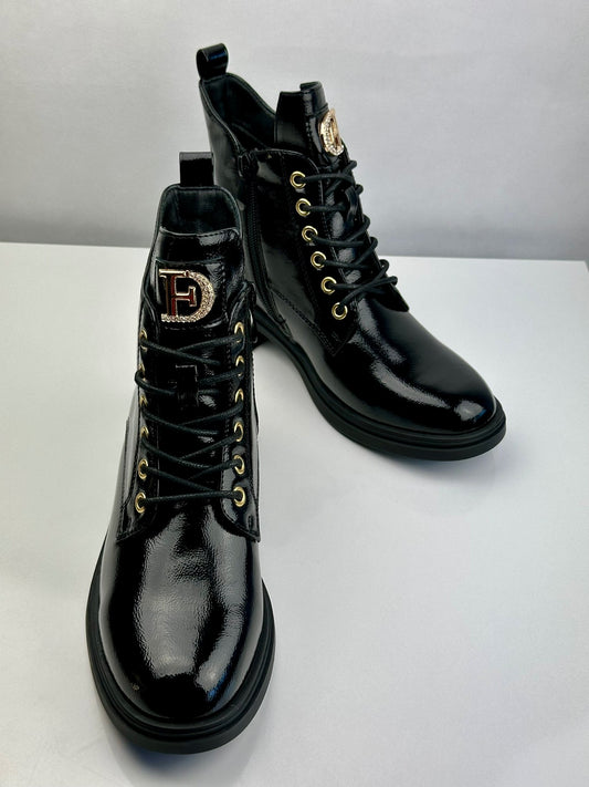 Military patent leather boot with appliqué.
