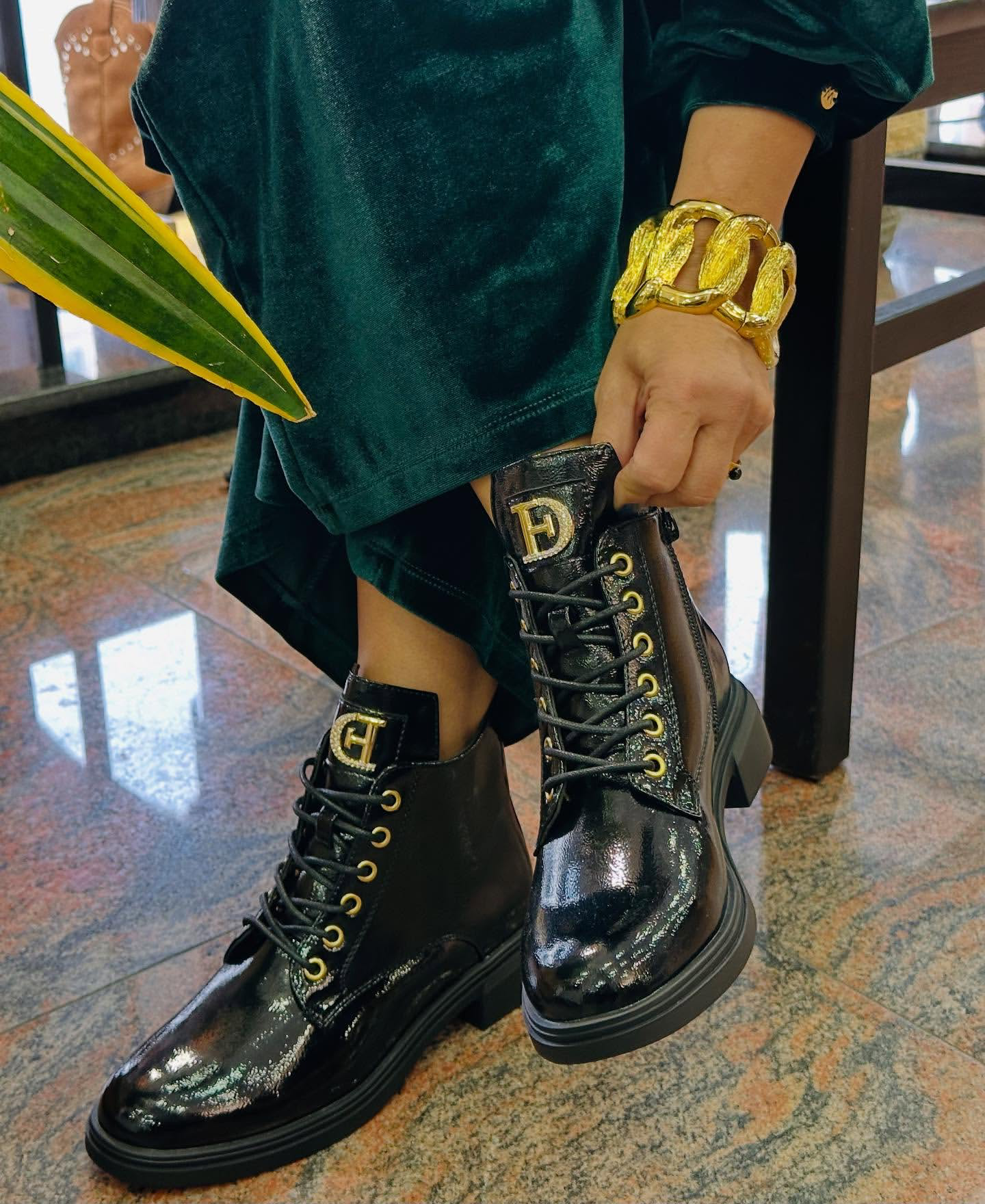 Military patent leather boot with appliqué.